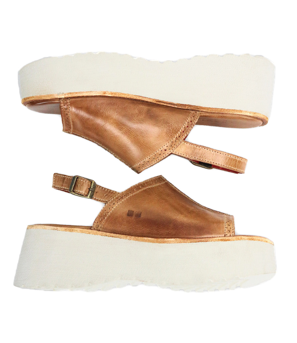 A pair of Bed|Stü Library brown leather platform sandals with white thick soles and side buckle closures, shown from the side on a white background—these classic shoes channel ‘90s style for a perfect blend of retro footwear and modern comfort.