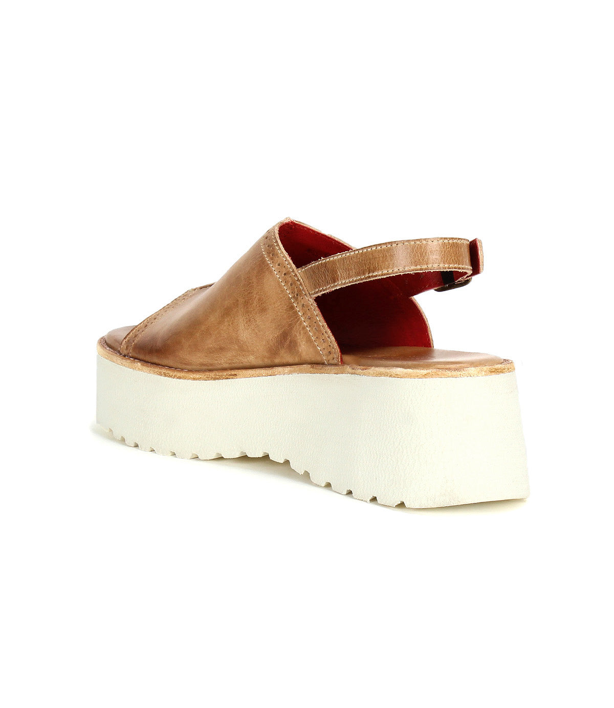 The Bed|Stü Library platform sandal features an open toe, thick white sole, and back strap in a tan finish, seen from an angle that highlights its heel and side—a seamless throwback to ‘90s retro style.