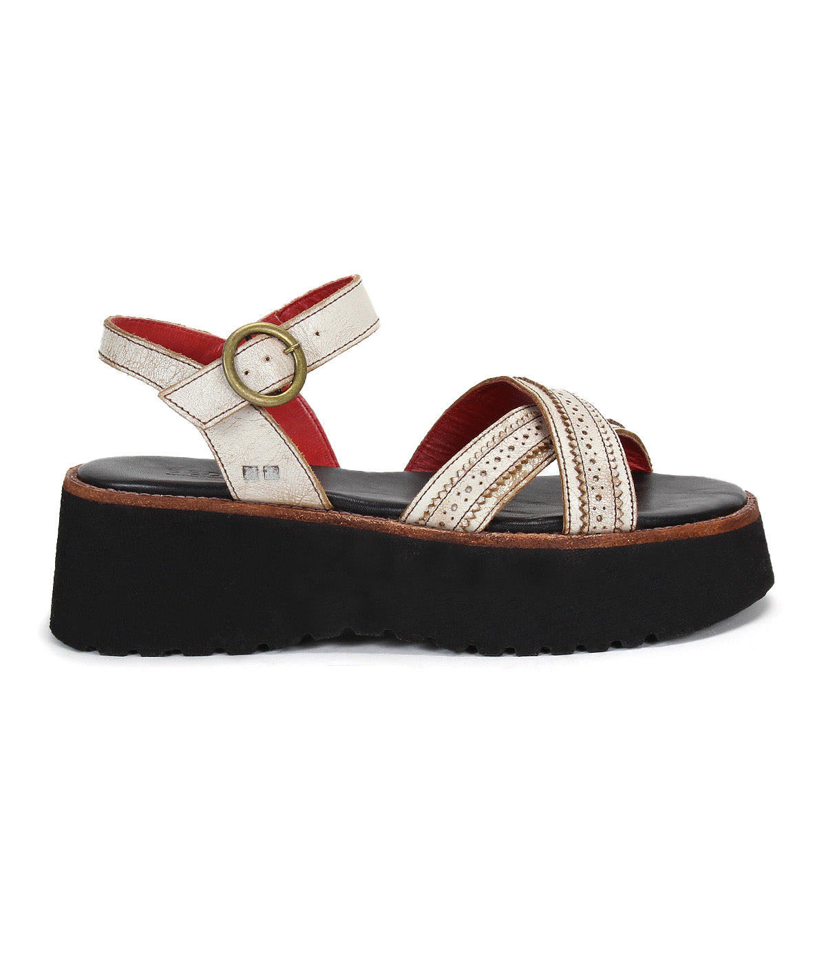 The Bed|Stü Lift sandal features white leather crisscross straps, a gold buckle, bold red interior detailing, and a thick black platform sole—shown in side view for a chic yet comfortable option.