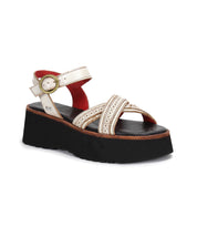 The Lift sandal by Bed|Stü features white crossed toe straps with decorative stitching, an adjustable ankle strap with a gold buckle, and a chunky black sole—seamlessly blending modern style and exceptional comfort for those seeking contemporary platform sandals.