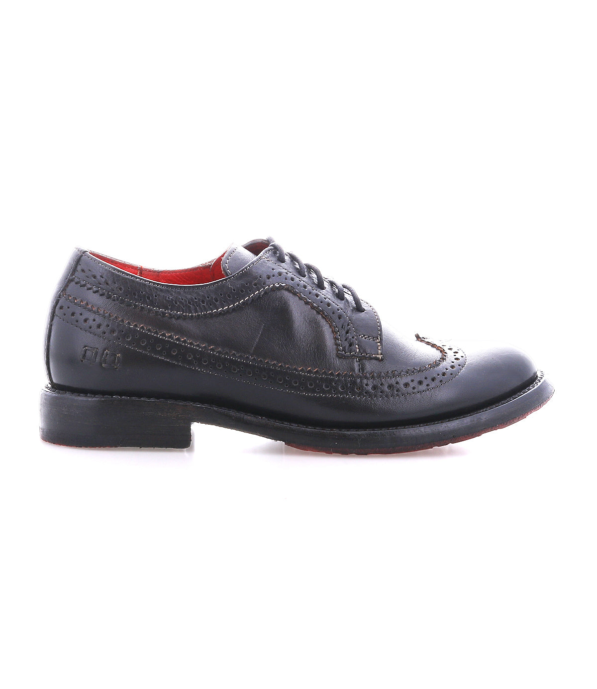 The Bed|Stü Lita K II is a single black leather dress shoe with classic brogue detailing and a wingtip toe, featuring decorative perforations, lace-up closure, and a low heel, shown in profile against a white background.