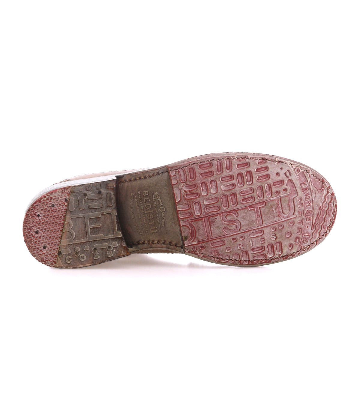 The image displays the worn sole of the Bed|Stü Lita K II shoe, featuring textured tread patterns and embossed branding, viewed from the bottom against a white background—a subtle tribute to classic derby craftsmanship that pairs elegantly with brogue details or a defined wingtip toe.