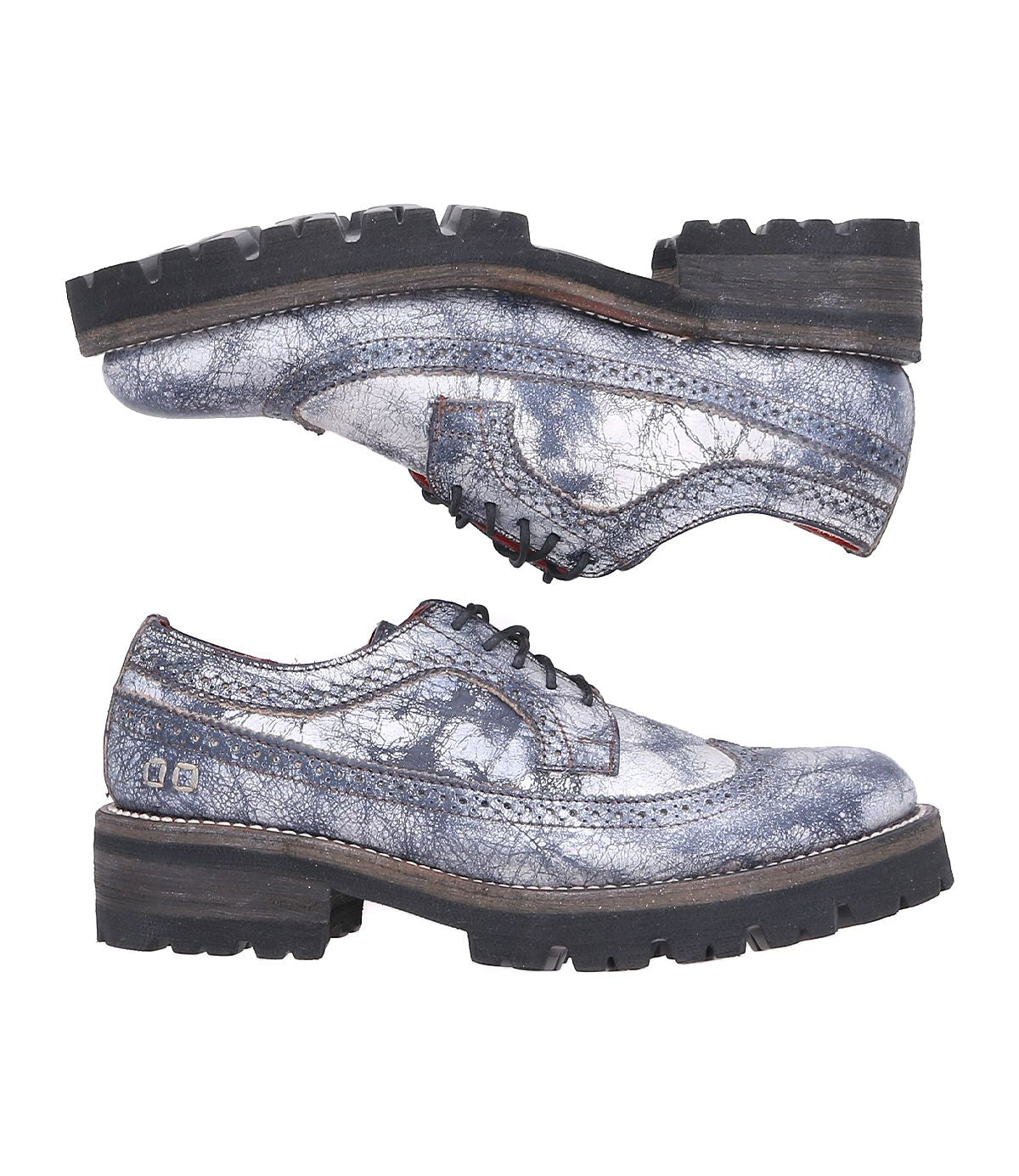 Two Lita K III shoes by Bed|Stü, crafted from distressed gray leather with lace-up fronts and thick black treaded soles that blend vintage-inspired details, are displayed side by side against a white background.