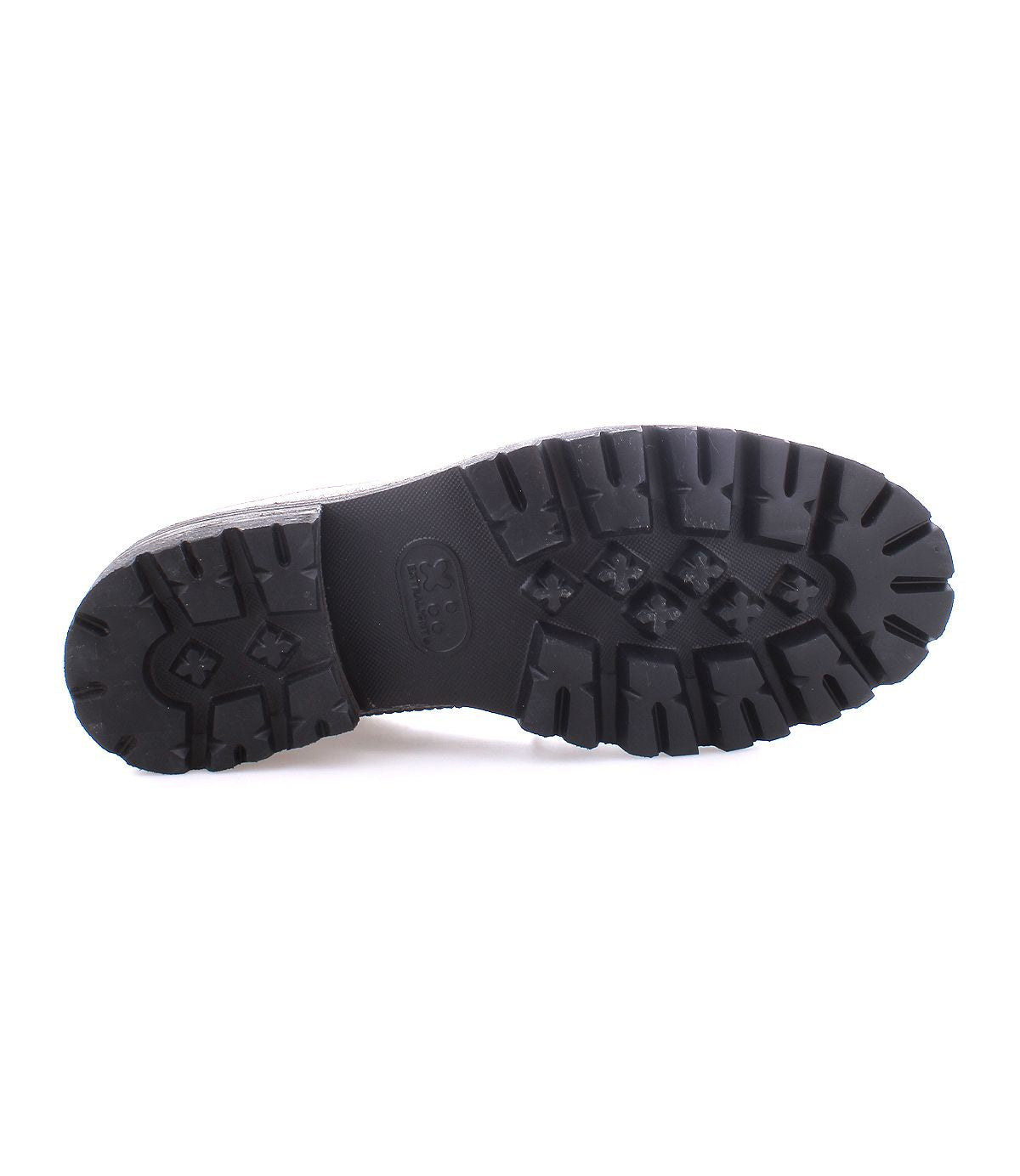 Black rubber shoe sole with deep tread pattern, shown from the bottom against a white background—perfect for the Bed|Stü Lita K III, a retro-inspired sneaker crafted with canvas and leather.