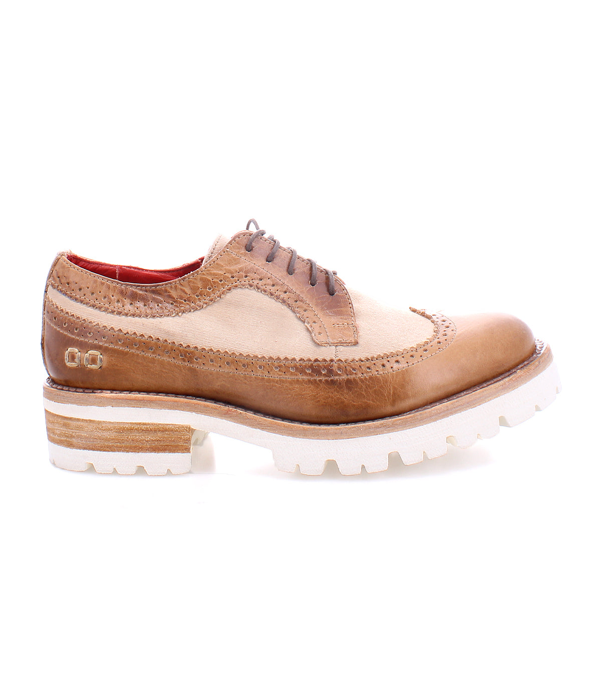 The Lita K III by Bed|Stü is a brown and beige leather oxford featuring brogue detailing, brown laces, and a white chunky sole. Shown in side profile on a white background, this vintage-inspired shoe blends classic elegance with modern appeal.