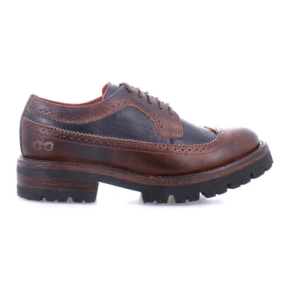 Introducing the Lita K III by Bed|Stü: a brown and black leather wingtip brogue shoe with a thick treaded sole, inspired by vintage designs and photographed from the side against a white background.