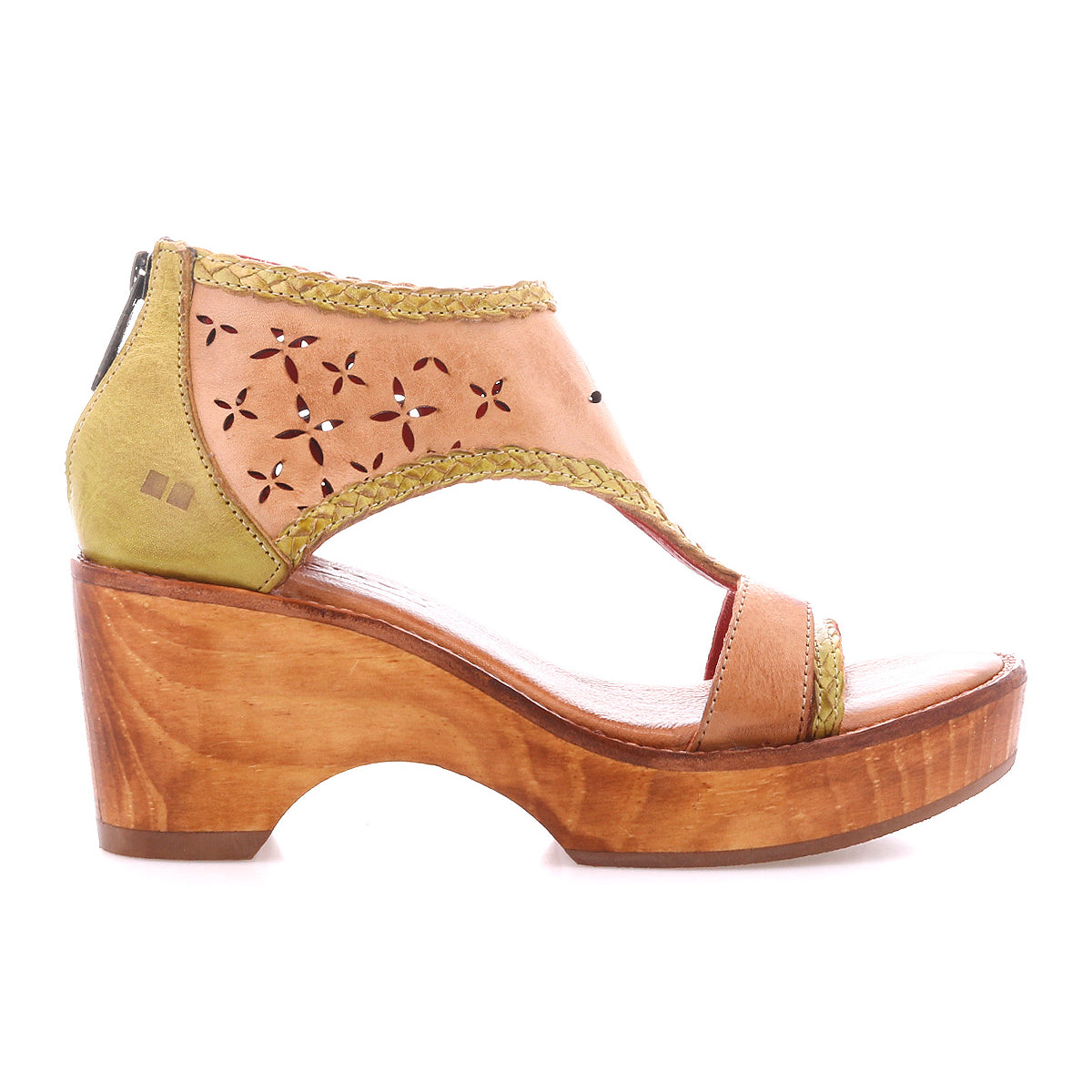 Introducing Locket by Bed|Stü: a tan and olive green sandal featuring a sculpted wooden platform heel, a laser-cut floral leather upper, decorative stitching details, convenient back zip closure, and a cushioned footbed designed for all-day comfort.