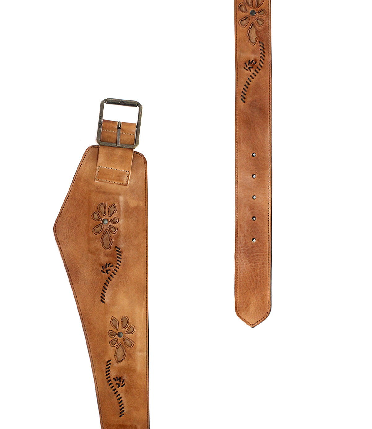 The Lucen belt by Bed|Stü is a brown leather boho-chic accessory featuring a wide section, intricate floral carvings, a metal buckle, and multiple adjustment holes—an expressive piece that adds artistic flair to any outfit.