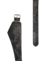 The Lucen wide black leather belt by Bed|Stü, featuring silver buckle and floral embroidery, is shown laid flat with both ends visible on a white background—an eye-catching accessory that brings boho-chic flair to any outfit.