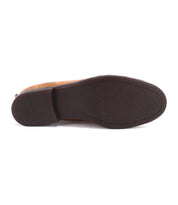 The image displays the bottom view of the Bed|Stü Lumaro brown men’s loafer, featuring a flat, textured rubber sole, set against a white background.