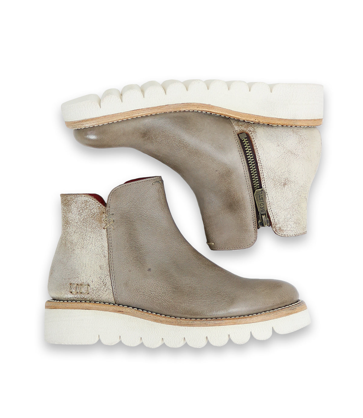 A pair of Bed|Stü Lydyi taupe leather ankle boots featuring a platform outsole, white textured soles, a side zipper, and a smooth upper surface, displayed from both the side and sole views.