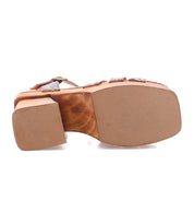 Bottom view of the Bed|Stü Lyxon sandal in brown, showcasing its wooden platform heel, square toe, and textured rubber sole.