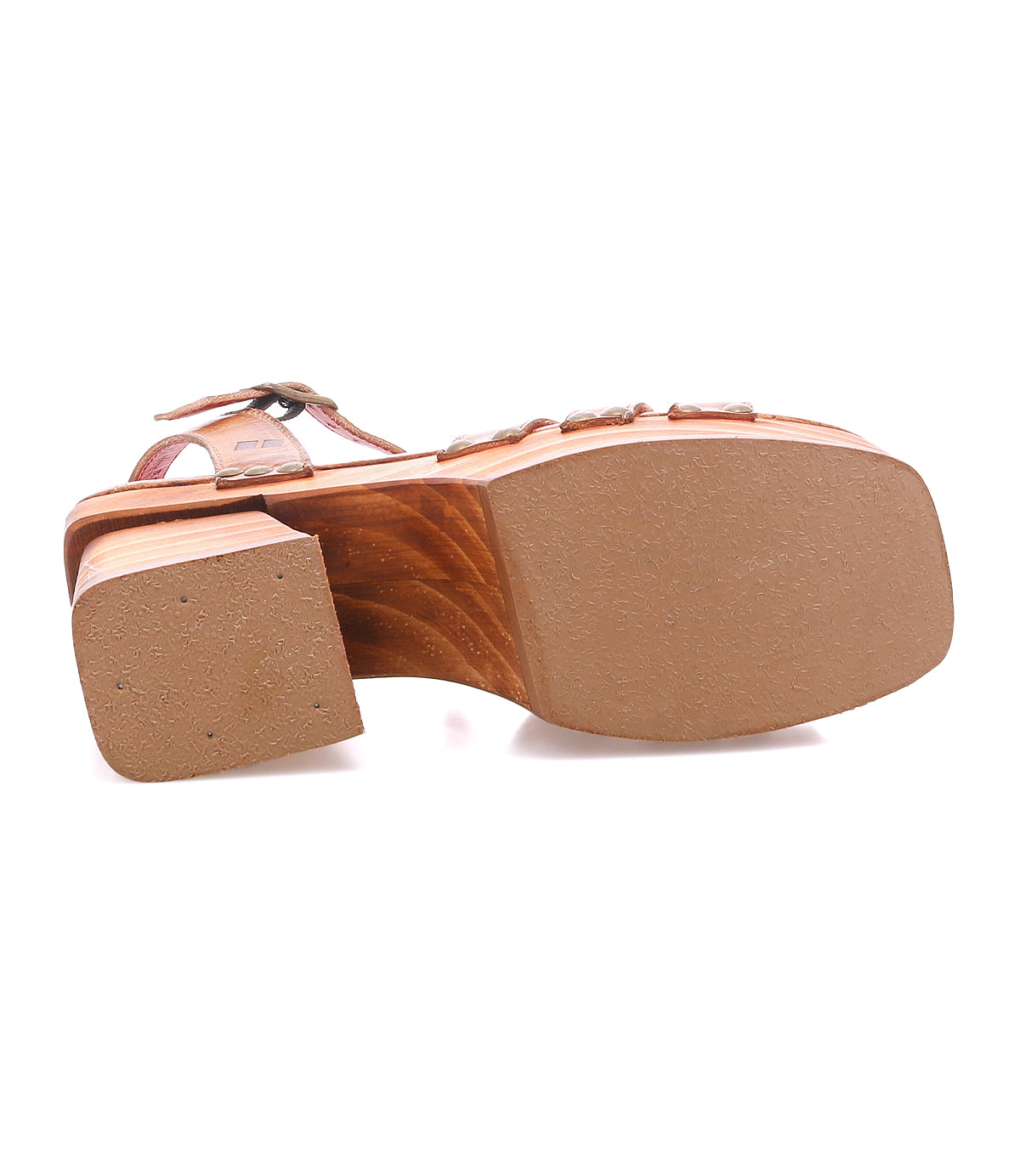Bottom view of the Bed|Stü Lyxon sandal featuring a wooden block platform heel, open-toe styling, and a flat, textured rubber outsole.