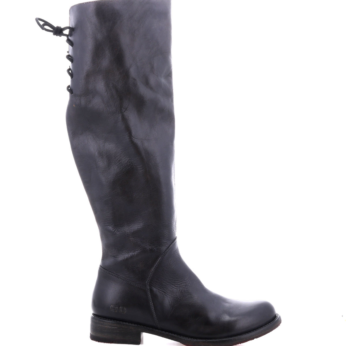 A single Manchester boot by Bed|Stü in black leather is shown in side profile against a white background, featuring a modern classic knee-high design with an elegant lace-up detail at the back upper shaft and a low, comfortable flat heel.
