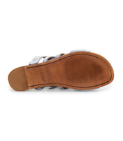 Bottom view of the Bed|Stü Margin slide sandal, showcasing a brown sole with horizontal grip lines at the front and visible stitching around the edge—a versatile addition to any summer wardrobe.