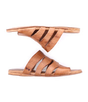 The Bed|Stü Margin sandals are brown leather slip-ons showcasing a sleek leather upper with three cut-out straps, displayed from the side and top angles on a white background—an essential addition to any summer wardrobe.