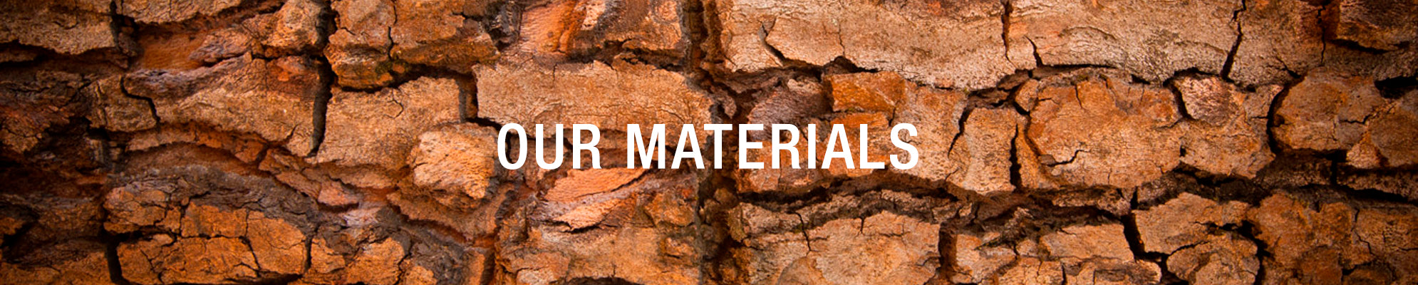 Banner showing cracked tree bark with the text “Our Materials.”
