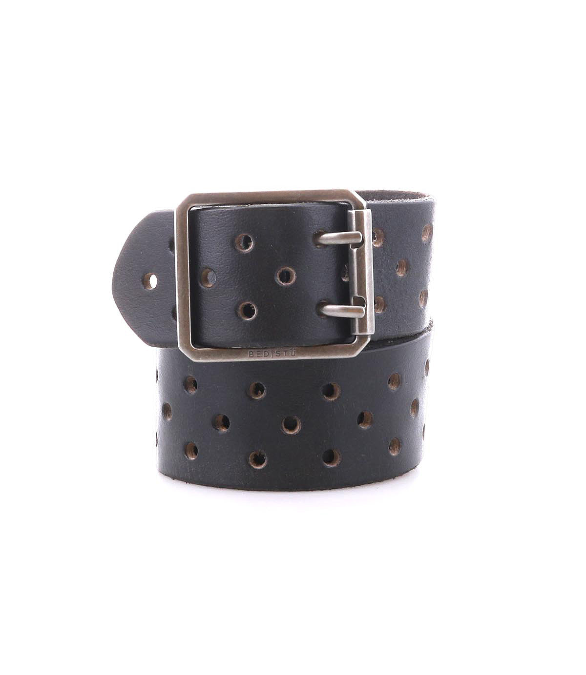 Introducing the Bed|Stü Mccoy: a black leather strap belt featuring round metal holes and a sturdy metal buckle, neatly coiled with the buckle facing forward for a personalized fit.
