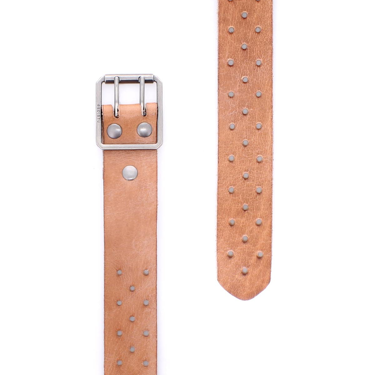The Bed|Stü Mccoy is a tan leather belt featuring a durable metal buckle and rows of metal studs along the length of the strap, displayed in both close-up and extended views against a white background.