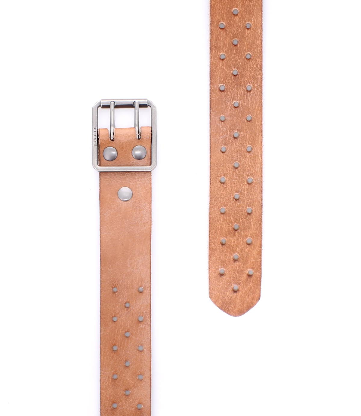 The Bed|Stü Mccoy is a tan leather belt featuring a durable metal buckle and rows of metal studs along the length of the strap, displayed in both close-up and extended views against a white background.