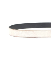 A close-up view of the Bed|Stü Meander belt in light beige distressed leather, showcasing its textured surface, black inner lining, and antique metal buckle, set against a white background.