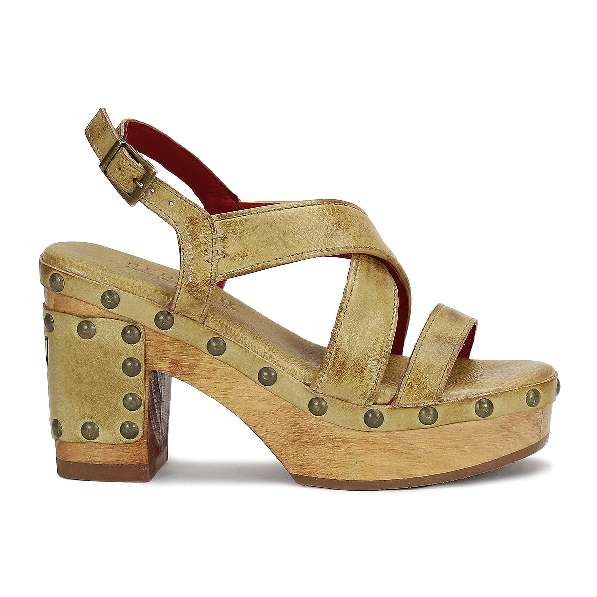 Bed|Stü "Mediation" tan platform heeled slingback sandal, featuring crisscross leather straps, metal stud accents along the sole, a chunky heel, cushioned insole for extra comfort, and an adjustable ankle buckle strap, displayed in side profile.
