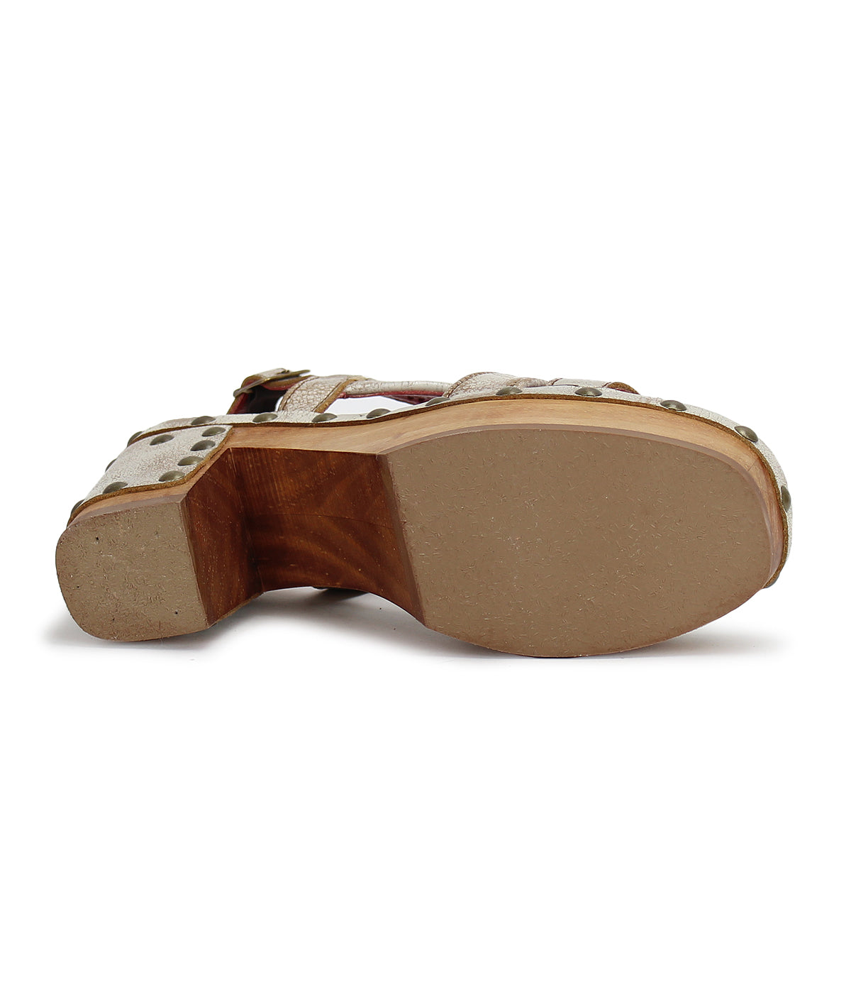 The Bed|Stü Mediation sandal features sleek leather straps for a secure fit, a cushioned insole for lasting comfort, and a wooden heel. Shown from the bottom, it displays a smooth beige sole accented with metal studs around the edge.
