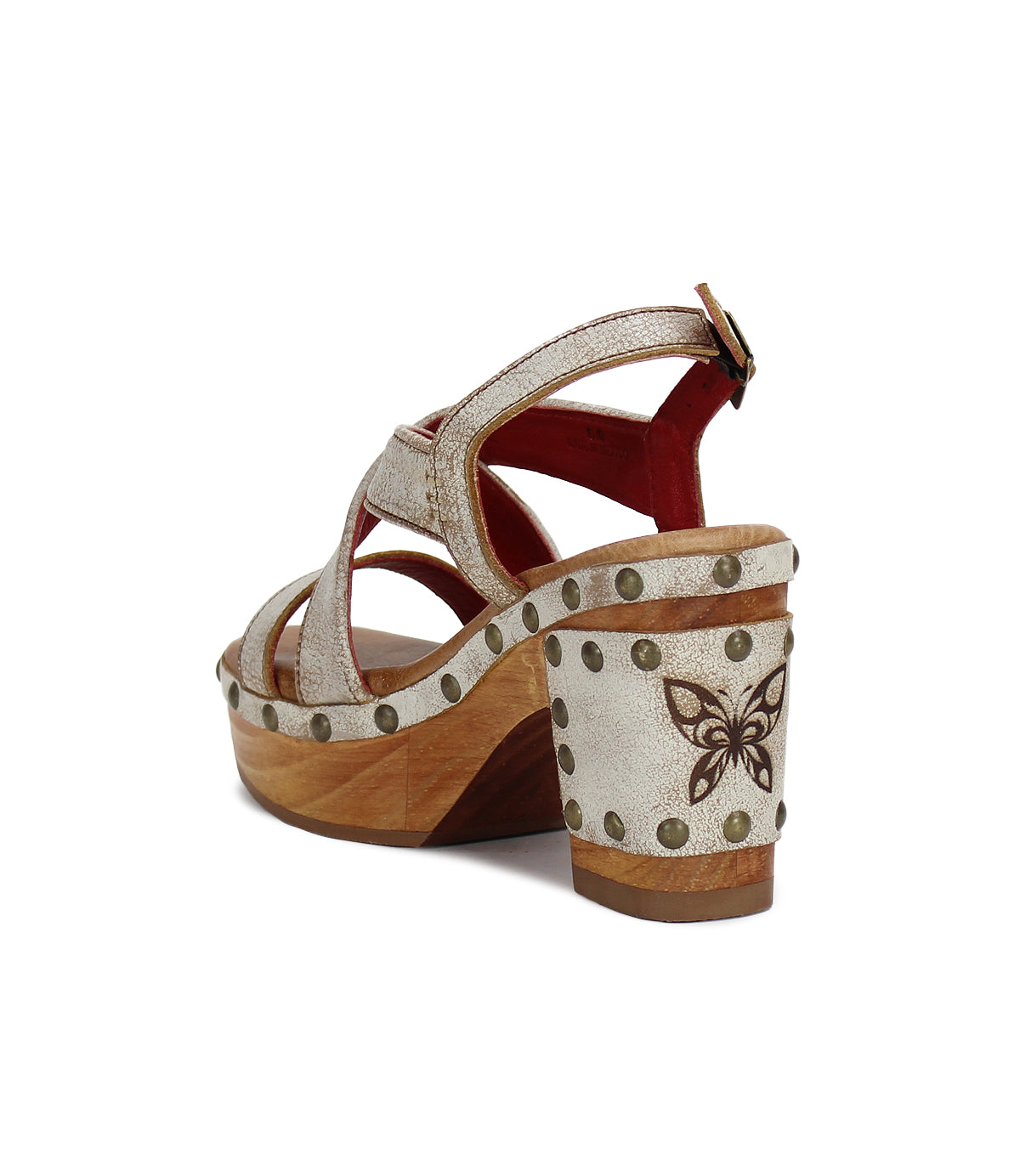 Introducing Mediation by Bed|Stü: a beige slingback sandal with a wooden block heel, decorative studs, crisscross leather straps, and a butterfly design accenting the back of the heel.