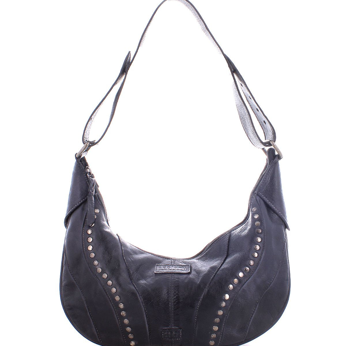The Megara by Bed|Stü is a black leather saddle bag with silver studs, featuring a curved silhouette and an adjustable strap with refined leather details. Shown on a white background, this stylish shoulder bag effortlessly combines edgy design with everyday elegance.