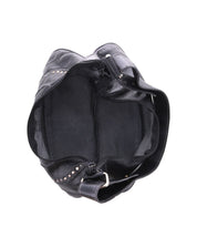 Top view of the Bed|Stü Megara shoulder bag in black leather, featuring a zipper closure, silver studs, and a wide strap with leather detailing, photographed against a white background.