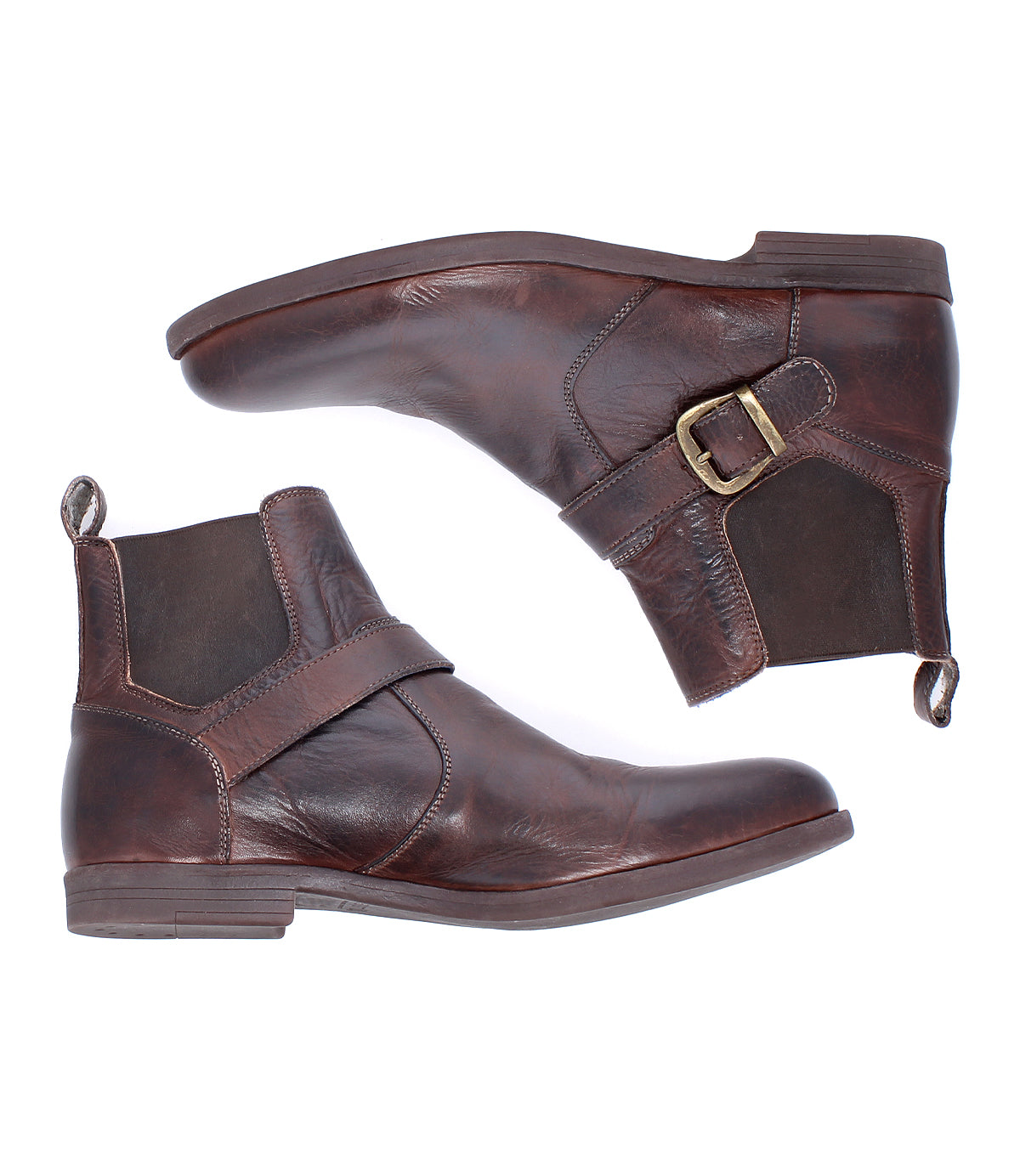 A pair of Bed|Stü Michelangelo brown leather ankle boots with side buckles and low heels, featuring a durable rubber outsole, shown from the side on a white background.