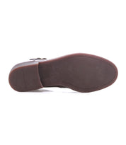 The image shows the bottom view of the Bed|Stü Michelangelo, a brown dress shoe featuring a flat, slightly textured, durable rubber outsole and a low heel.