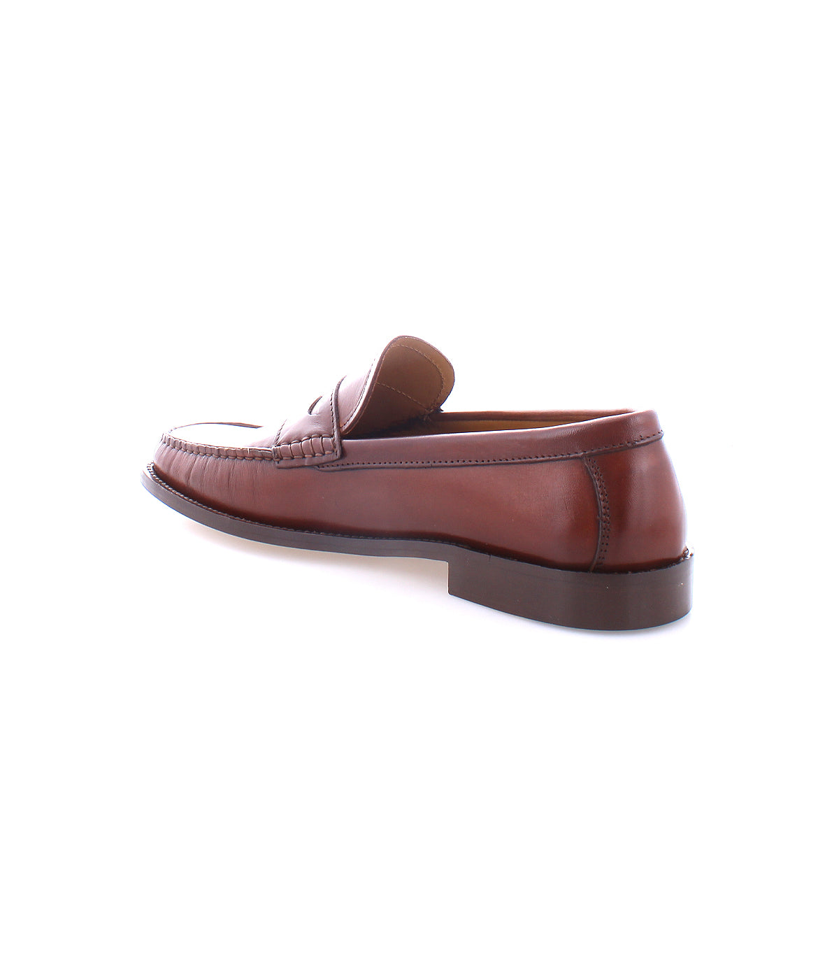 The Bed|Stü Moat, a single handcrafted loafer in rich brown leather, is displayed at an angle on a white background, highlighting the shoe’s side and back details.