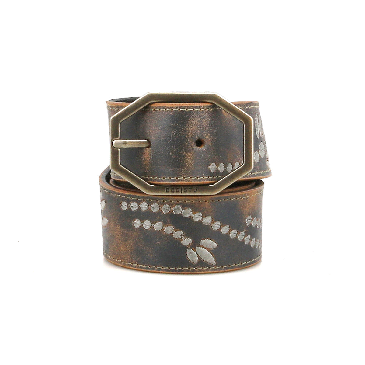 Bed|Stü's Mohawk belt showcases a western-inspired style with distressed brown leather, a metallic rectangular buckle, and a decorative white dotted pattern.