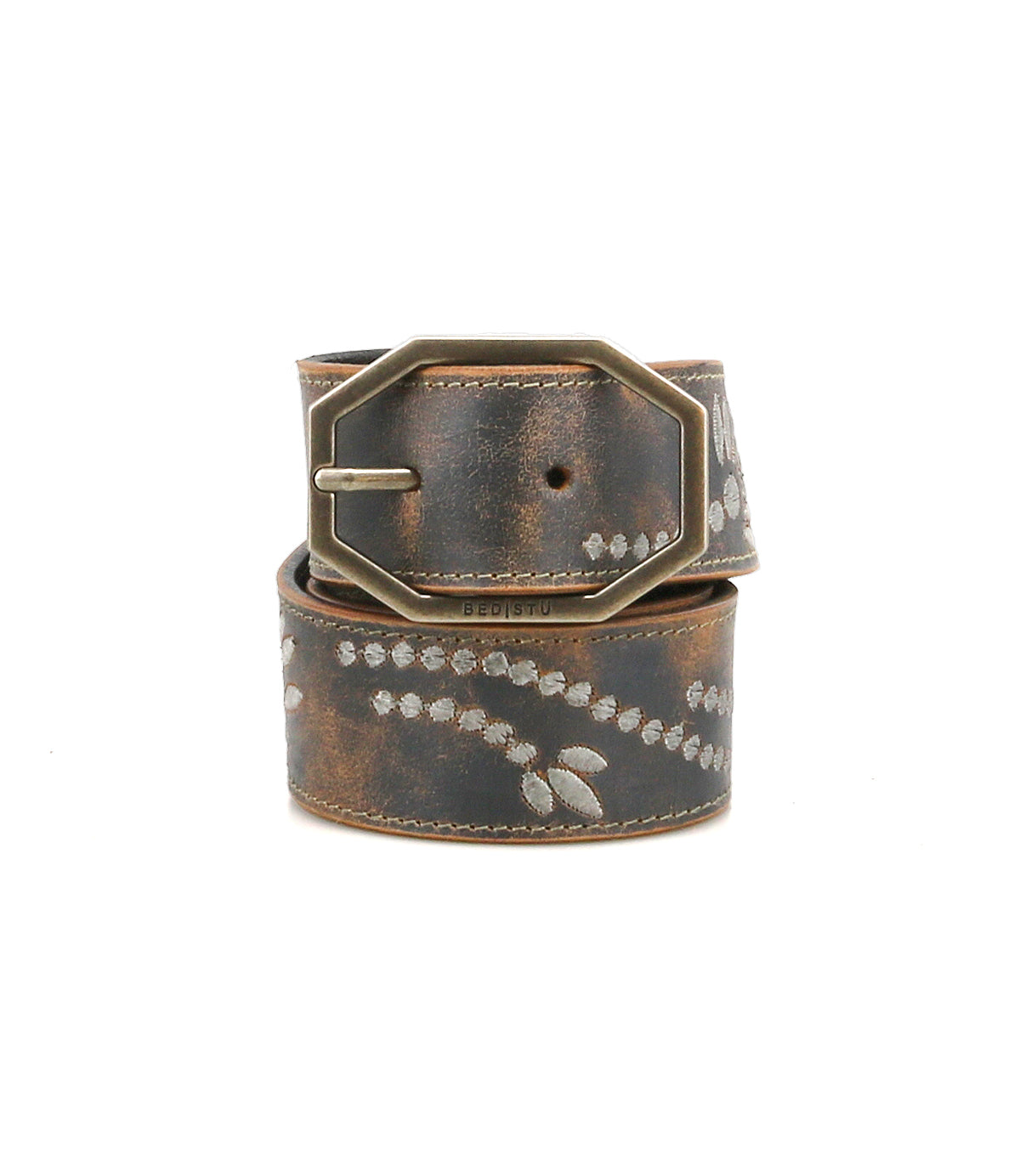 Bed|Stü's Mohawk belt showcases a western-inspired style with distressed brown leather, a metallic rectangular buckle, and a decorative white dotted pattern.