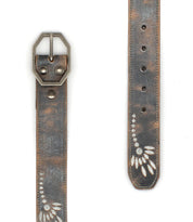 The Mohawk women's floral belt by Bed Stu features distressed leather, a silver buckle, metal rivets, and a white leaf pattern at the tip, adding vintage charm to any outfit.