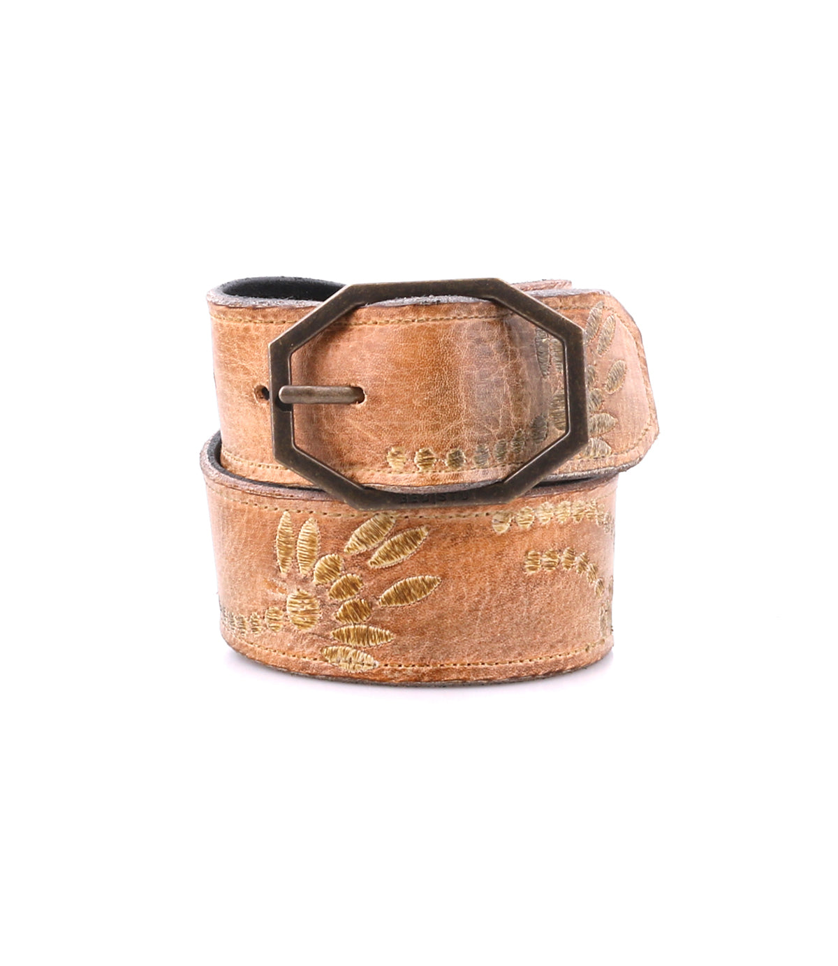 Bed|Stü’s Mohawk belt features rich brown distressed leather, eye-catching floral embroidery, and a distinctive hexagonal metal buckle—rolled up on a white background, it's perfect for adding a touch of western-inspired style to any outfit.