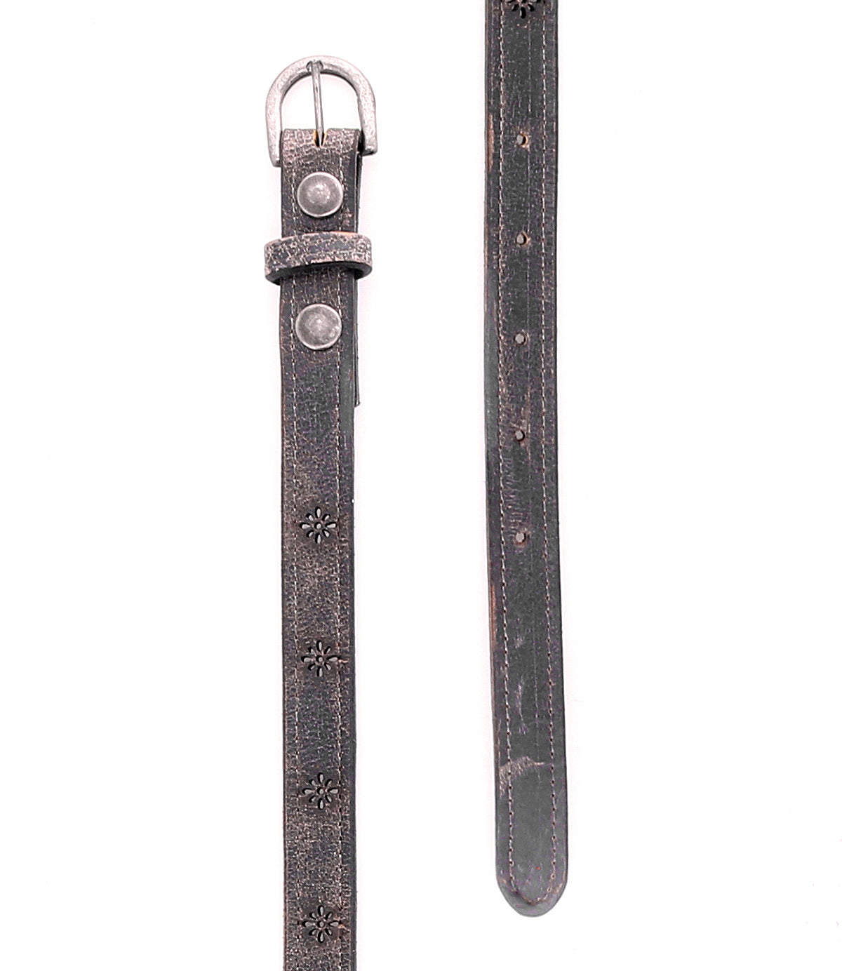 A close-up of the Bed|Stü Monae II, a worn black leather belt with a silver buckle and embossed flower designs, shown both buckled and unbuckled on a white background. This versatile women’s belt features intricate floral cutout details, adding unique character to the classic Monae II leather style.