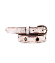 The Monae II by Bed|Stü is a white leather belt featuring floral cutout patterns, a metal buckle, and a distressed finish, shown coiled against a white background. This versatile women’s belt effortlessly brings charm and style to any outfit.