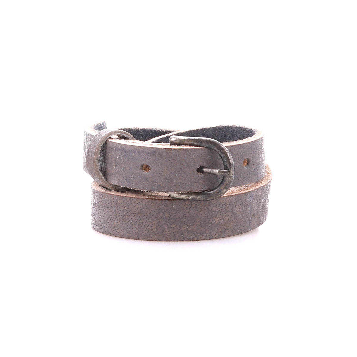 The Monae by Bed|Stü is a slim, dark brown leather belt featuring a classic silver metal buckle, elegantly coiled in a circle on a white background—an essential addition to any everyday wardrobe.