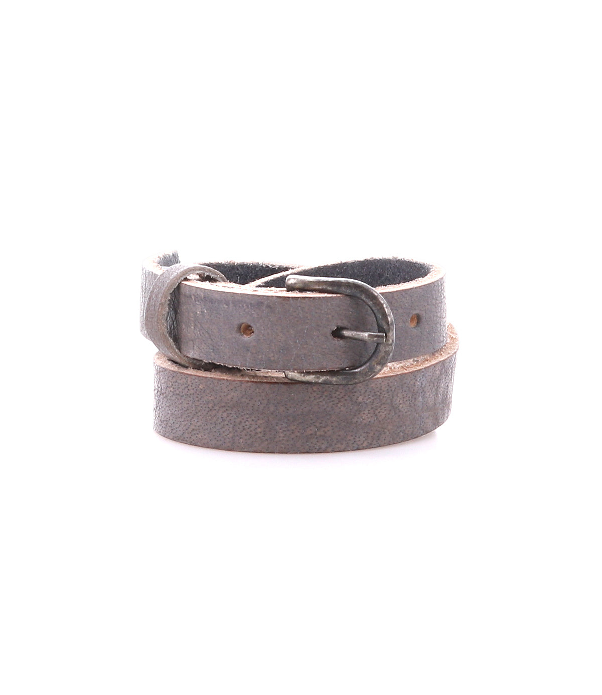 The Monae by Bed|Stü is a slim, dark brown leather belt featuring a classic silver metal buckle, elegantly coiled in a circle on a white background—an essential addition to any everyday wardrobe.