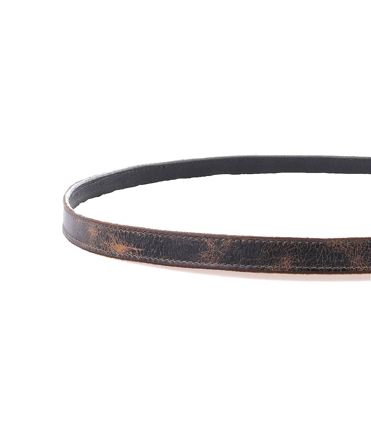 The Bed|Stü Monae is a brown leather belt with visible creases, featuring a timeless buckle, displayed in a circular shape on a white background.