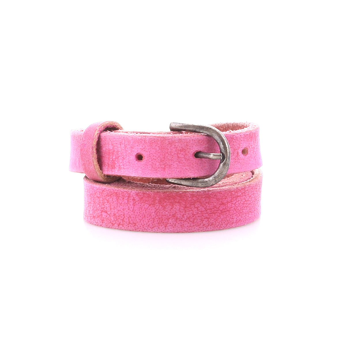 The Monae by Bed|Stü is a slim pink leather belt with a classic silver buckle, styled in a coil on a white background—an elegant addition to any everyday wardrobe.