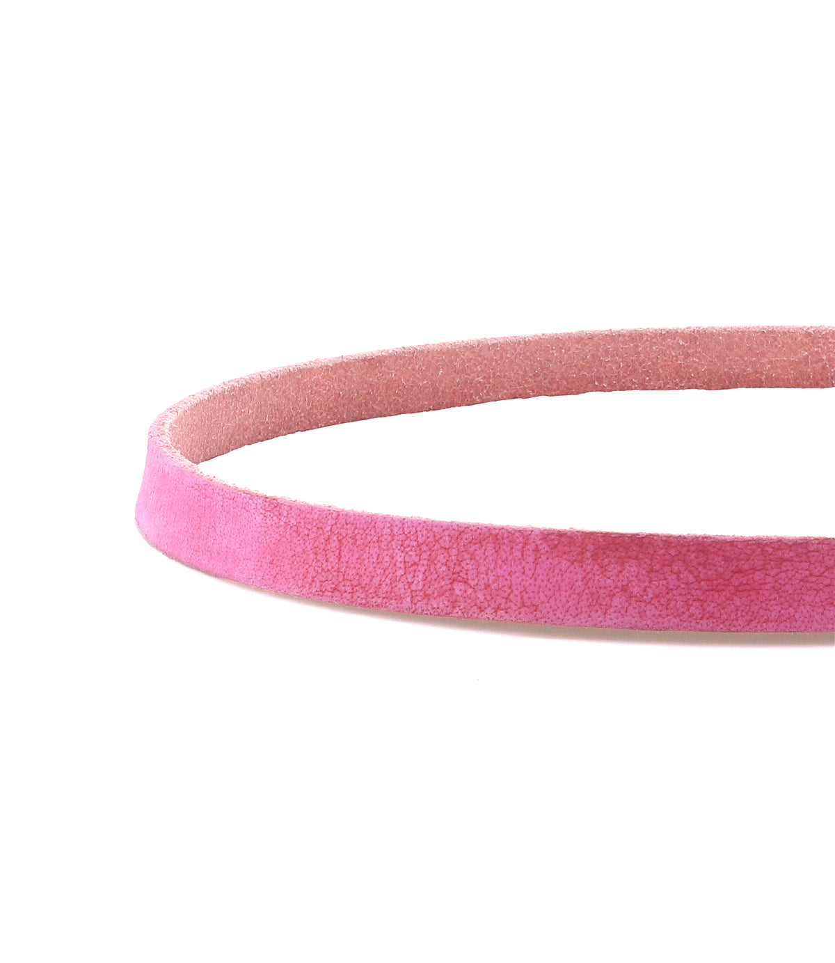 A close-up of the Monae choker necklace by Bed|Stü, featuring a pink, suede-textured band and a timeless buckle, set against a white background.