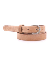 The Bed|Stü Monae—a slim, light brown leather belt with a classic silver buckle—coiled elegantly on a white background, is an effortless addition to your everyday wardrobe.