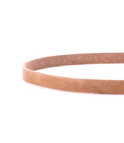A close-up of the Monae slim leather belt by Bed|Stü, featuring a timeless buckle and artfully arranged in a circular shape on a white background—an essential accessory for your everyday wardrobe.