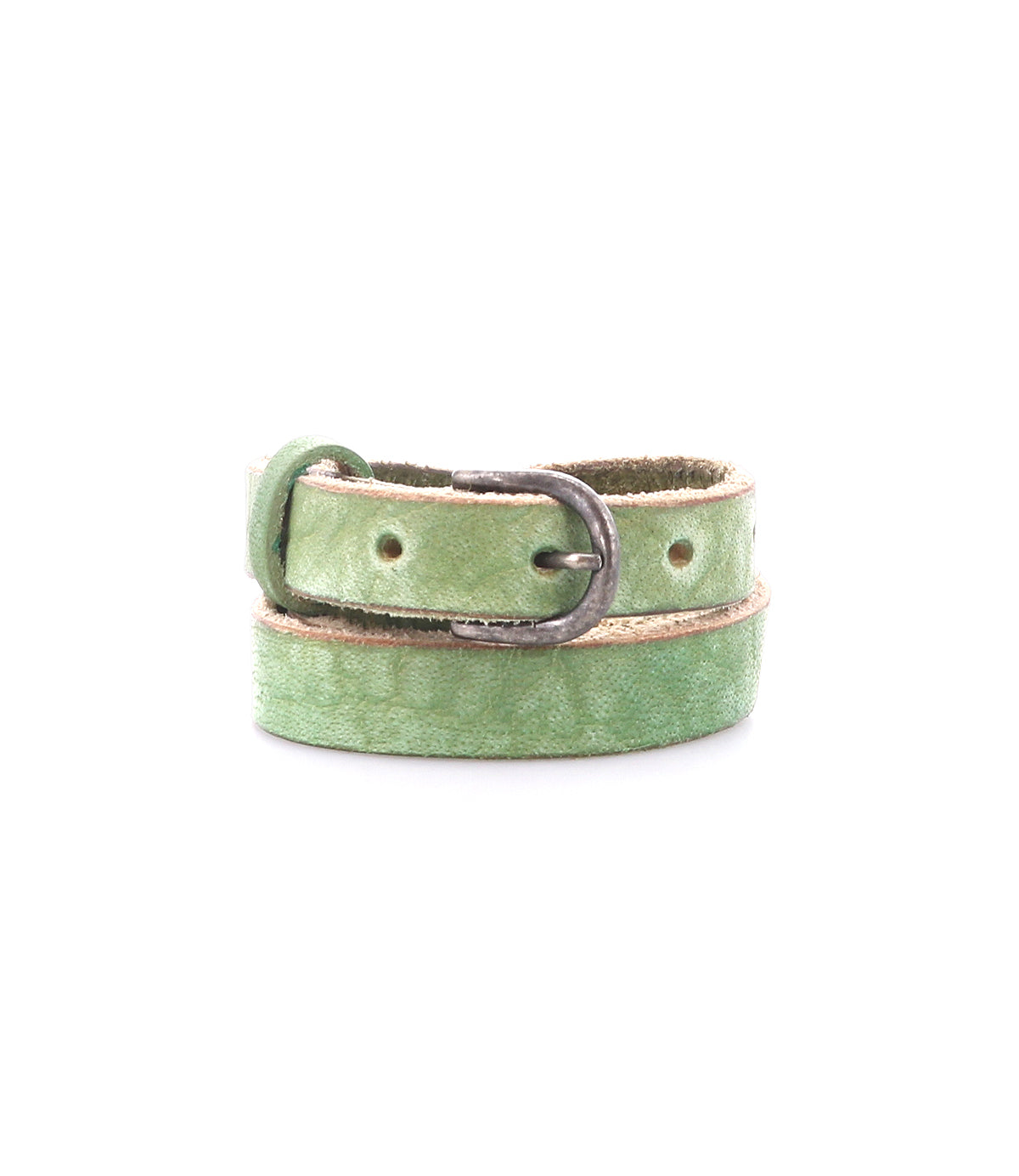 The Bed|Stü Monae belt, crafted from slim light green leather and finished with a classic silver buckle, is elegantly coiled against a white backdrop—an effortlessly stylish addition to any everyday wardrobe.