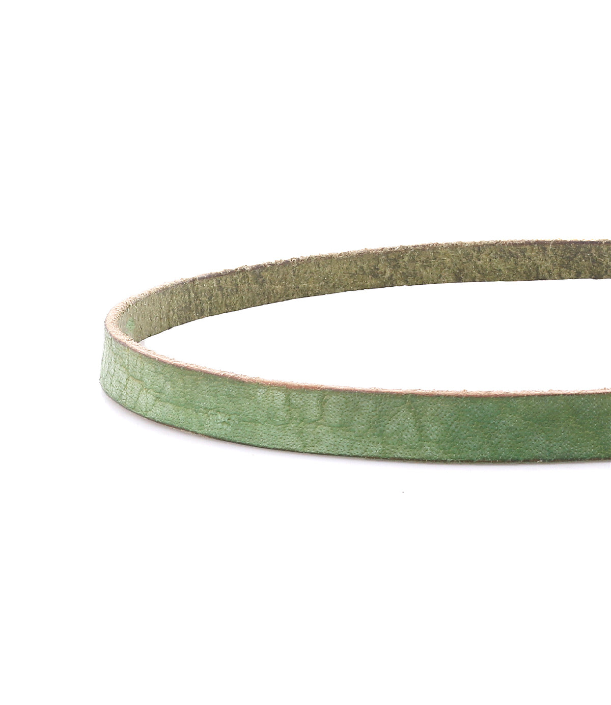 A close-up of the Bed|Stü Monae slim leather belt in green, showcasing its textured leather strap with a suede underside, set against a white background—an essential piece for the everyday wardrobe.