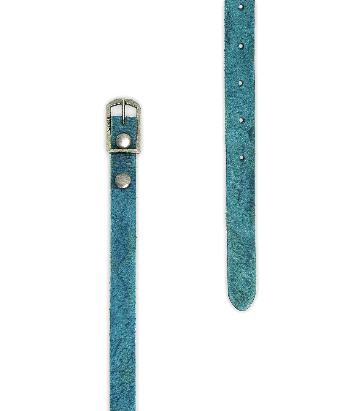 Discover two views of the Bed|Stü Monae belt, crafted in slim, blue leather with sleek metal rivets and a classic buckle, elegantly laid flat on a white background—a stylish essential for your everyday wardrobe.