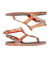 Bed|Stü’s Moon sandals feature flat brown and gray leather straps, a red inner lining, cushioned insoles for all-day comfort, ankle buckle closures, and stitched detailing—shown here from the side.